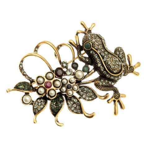 Frog brooch among flowers